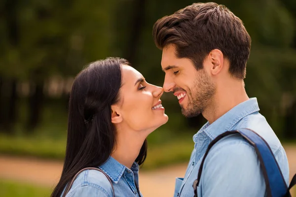 Profile photo of amazing pair going to kiss contacting noses closing eyes wear denim outfit — Stock Photo, Image