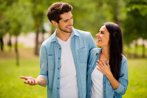 Photo of charming pair walking summer park speaking overjoyed wear denim outfit — Stock Photo, Image