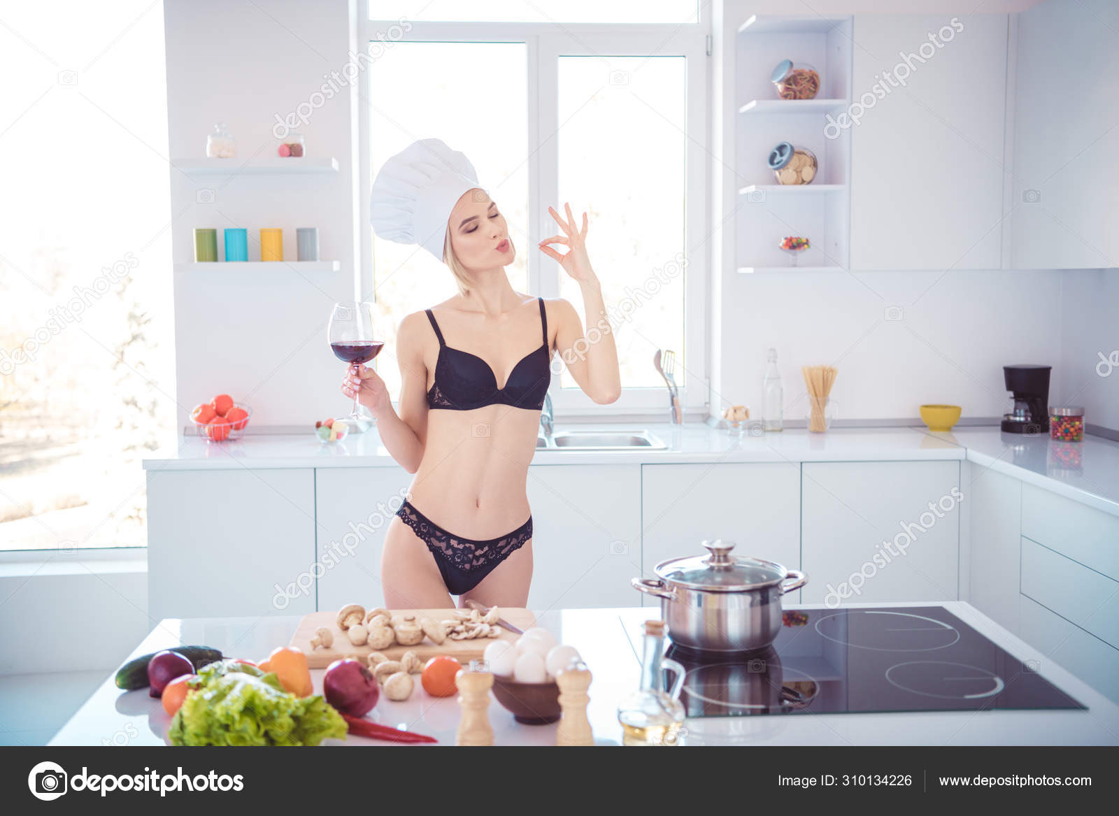 Girlfriend cooking breakfast in thong.