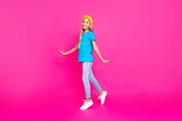 Full length photo of lovely cheerful positive child have walk go enjoy vacation with her friends wear shine bright outfit isolated over fuchsia color background — Zdjęcie stockowe
