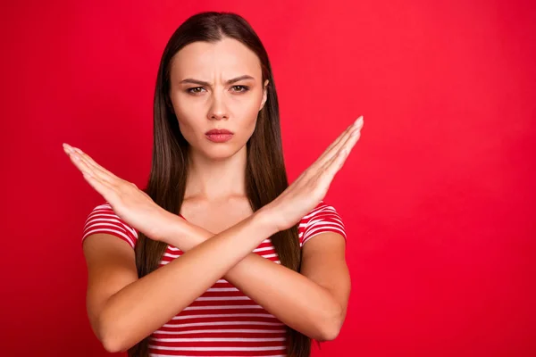 Close up photo of strict serious woman showing you crossed arms meaning to stop acting while isolated over red background — Stock Photo, Image