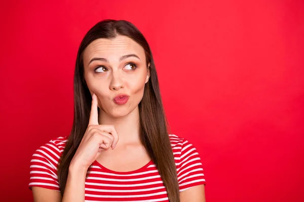 Close up photo of charming nice cute girlfriend wearing red t-shirt striped guessing pondering thinking about something while isolated over red background — Stock Photo, Image