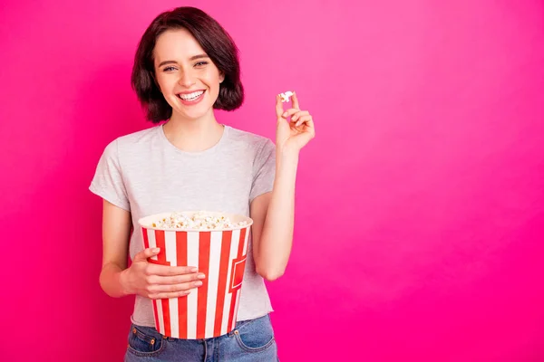 Photo of attractive rejoicing nice cute cheerful woman watching some comedy movie wearing jeans denim isolated with fuchsia vibrant color background — Stock Photo, Image