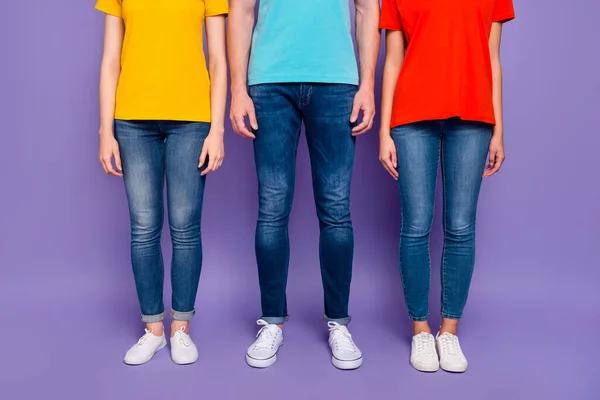 Close up photo of three people standing straight wearing street style clothes isolated violet background — Stock Photo, Image
