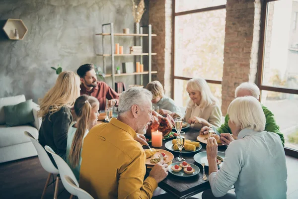 Portrait of nice lovely idyllic cheerful big full family brother sister couples eating tasty yummy meal dishes feast gratefulness autumn fall season in loft brick wood industrial style interior house — Stock Photo, Image