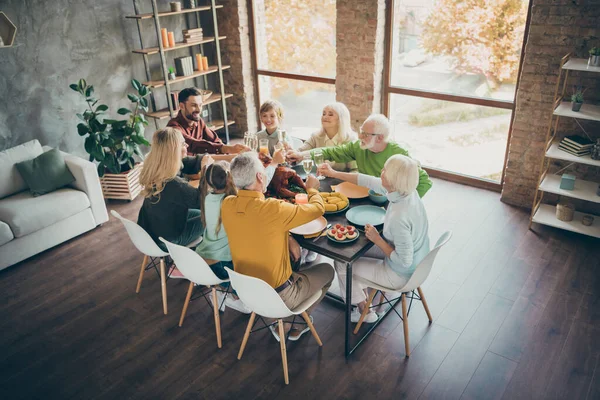 Top above high angle photo of happy large family gathering around table senior retired pensioner small little kids hold glass juice alcohol toast sit table enjoy thanksgiving november event in house — Stock Photo, Image