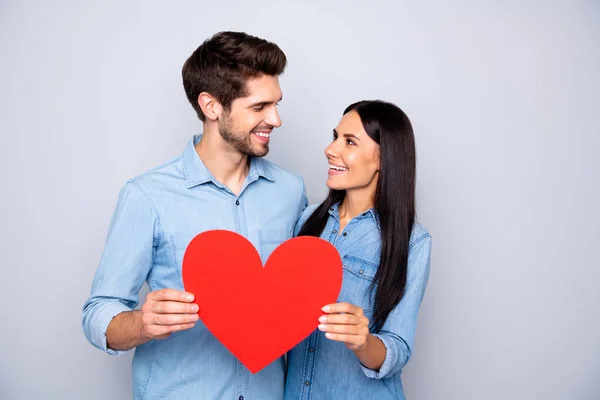 Portrait of his he her she nice-looking attractive charming lovely lovable tender cheerful cheery couple holding in hands heart 14 February isolated over light white gray pastel color background — Stock Photo, Image