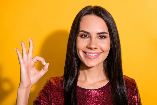 Closeup photo of amazing lady showing okey symbol approving good quality of work wear shiny red dress isolated yellow color background — Stock Photo, Image