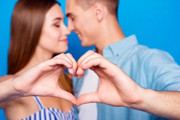 Cropped close-up portrait of her she his he two nice attractive charming cheerful tender gentle people showing heart symbol cuddling isolated over bright vivid shine vibrant blue color background — Stock Photo, Image