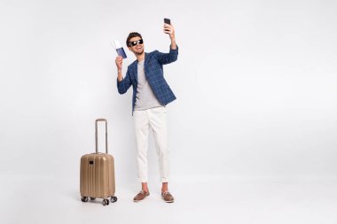 Full length body size view of nice attractive stylish cheerful cheery glad successful businessman tourist wearing blue checked blazer taking making selfie isolated over light white pastel background clipart