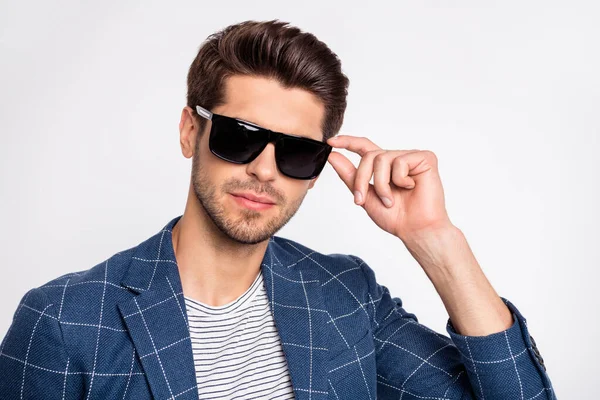 Close-up portrait of his he nice attractive lovely charming content focused businessman wearing blue checked blazer cool modern outfit touching specs isolated over light white pastel background — ストック写真