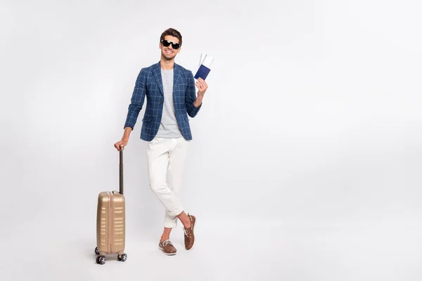 Full length body size view of nice attractive cheerful cheerful tourist wearing blue checked blazer holding in hands documents departure destination isolated over light white pastel background — стоковое фото