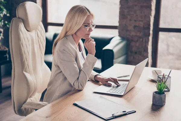 Photo of professional qualified executive assistant wearing glasses spectacles searching for new information about development and unification — Stock Photo, Image