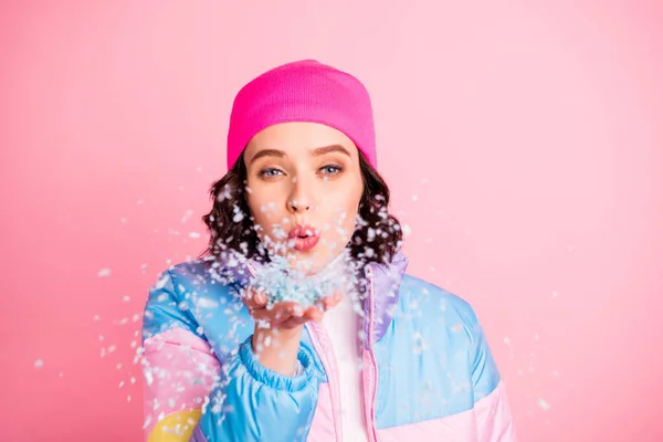 Close-up portrait of her she nice attractive lovely cheerful cheery funny girl having fun enjoying blowing snow weekend holiday isolated over pink pastel background — Stock Photo, Image