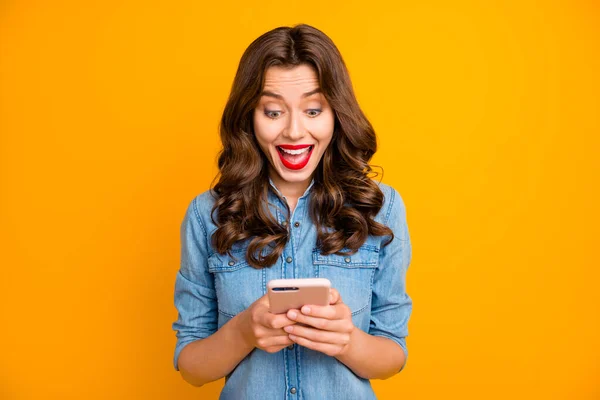 Photo of curly wavy white trendy style screaming girl shouting wow during chatting with her internet friend expressing positive emotions isolated over yellow vivid color background — Stock Photo, Image