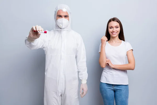 Photo of patient lady guy doc collected sample vein blood covid antibodies research vaccine donor center corona virus wear hood uniform plastic facial protection isolated grey color background — Stock Photo, Image