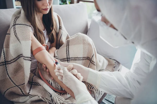 Cropped photo of patient lady guy doc injection sample probe vein blood covid antibodies research vaccine elastic harness on hand wear uniform suit protection quarantine indoors — Stock Photo, Image