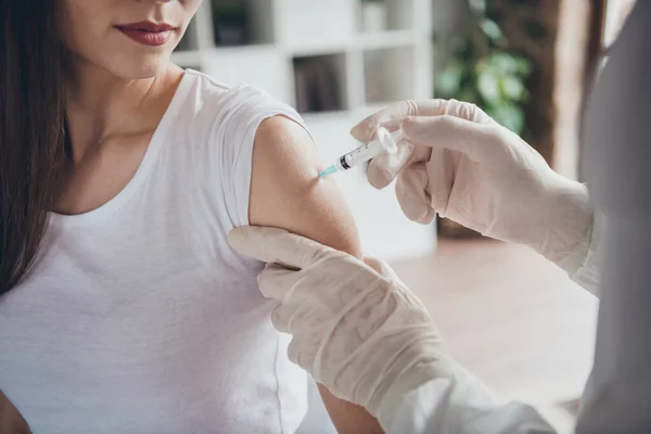 Cropped closeup photo of young ill patient lady unwell call emergency ambulance doc virologist flu cold covid injection shoulder medication wear latex gloves protective uniform indoors — Stock Photo, Image