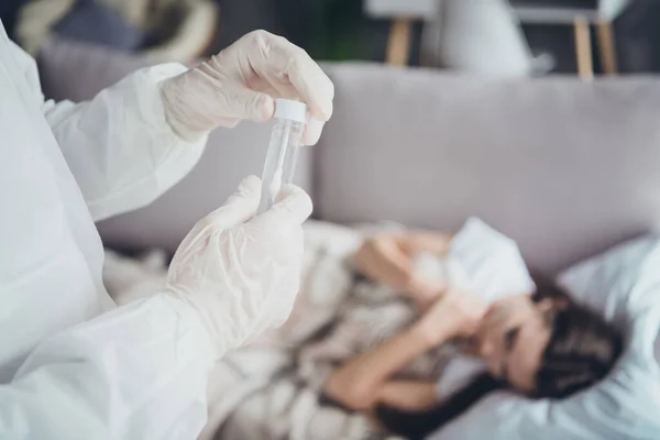Closeup blurred photo of young sick patient lady lying sofa unwell call ambulance doc virologist collected saliva mouth probe flu cold covid test wear latex gloves protective uniform indoors — Stock Photo, Image