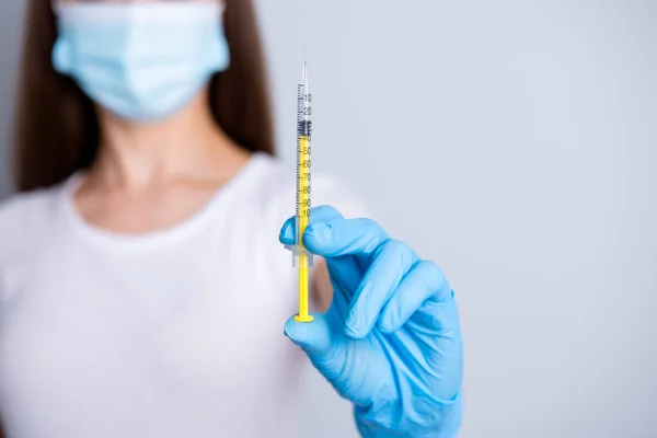 Closeup cropped photo of young lady doctor hospital examination clinic hold syringe dose patient vaccine injection treatment wear protect face mask isolated grey color background — Stock Photo, Image