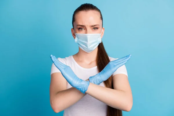 Photo of pretty serious lady crossing arms keep social distance avoid people crowd contact hospital examination wear protect face mask t-shirt isolated blue color background — Stock Photo, Image