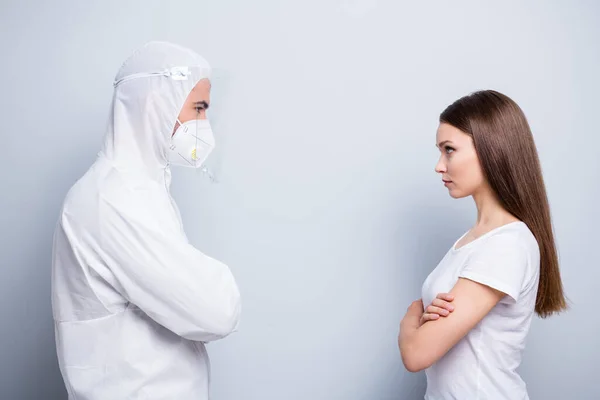 Profile photo of two people patient lady guy expert virology examination covid stand opposite bad mood wear mask hood uniform plastic facial protection isolated grey color background — Stock Photo, Image