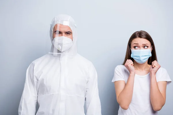 Photo of young patient lady terrified look guy expert doc virology examination fear take blood probe covid wear mask hood uniform plastic facial protection isolated grey color background — Stock Photo, Image