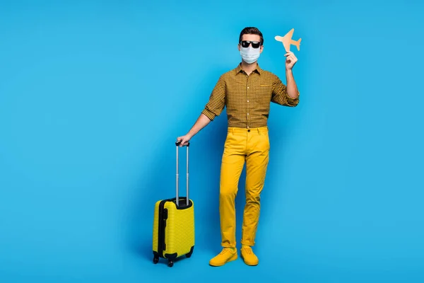 Full length body size view of nice guy wearing gauze mask gumshoes traveling abroad airplane open border quarantine enjoy business class isolated bright vivid shine vibrant blue color background