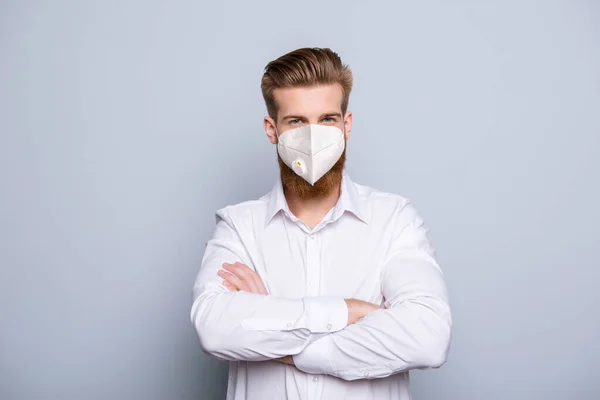 Portrait of his he nice atrakile masculine content healthy funky guy wearing white coat medical reusable mask folded arms isolated over grey pastel color background — Stok Foto