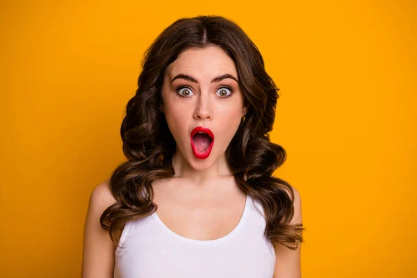 Closeup photo of pretty curly brunette lady red bright pomade cheerful person good mood open mouth listen amazing news wear white casual singlet isolated yellow color background — Stock Photo, Image