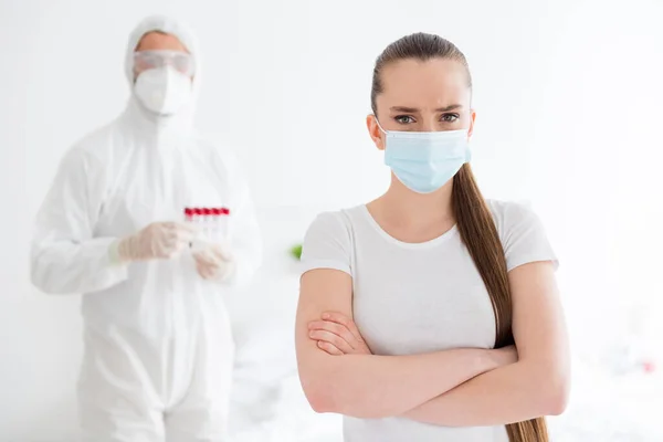 Photo of sick patient student lady arms crossed unwell call emergency doc virologist collected blood probe hold test tubes flu cold covid checkup wear mask protective uniform bedroom indoors — Stock Photo, Image