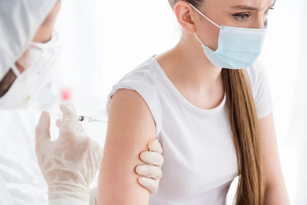 Cropped closeup photo of student patient lady unwell ill emergency doc virologist covid injection hand shoulder vaccine antidote wear latex gloves protective uniform suit bedroom indoors — Stock Photo, Image