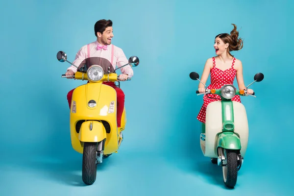 Foto de funky two people lady guy couple drive retro moped big speed travelers avoid traffic jam easy way formalwear vintage clothes isolated blue color background —  Fotos de Stock