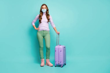 Full length body size view of her she slim pretty girl wearing safety gauze mask departing abroad risk ncov-2 cov mers respiratory prevention isolated green blue teal turquoise color background clipart