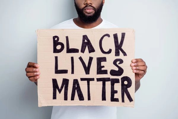 Stop violence concept. Cropped photo of disappointed dark skin african protester placard community against black citizens lawlessness police murder people isolated grey color background