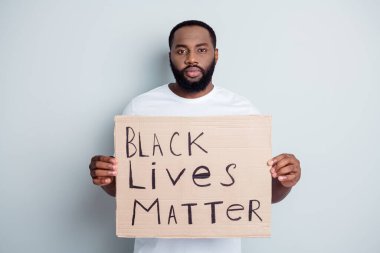 Black lives matter. Photo of serious disappointed dark skin african protester placard community against black citizens lawlessness stop murder people concept isolated grey color background clipart