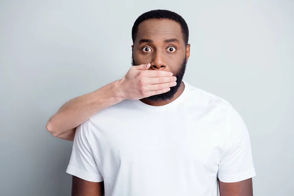 Shut up. Photo of helpless african american guy unfairly society black race citizens white skin arm close his mouth threatening danger lawlessness iniquity isolated grey color background