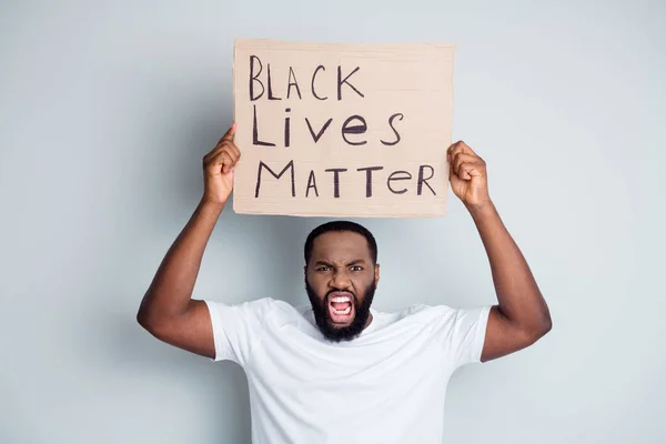 Photo of crazy yell dark skin african city protester placard show negative attitude black citizens social lawlessness call government stop murder black people isolated grey color background — Stock Photo, Image