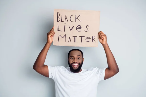 Black lives matter. Photo of cheerful dark skin african protester hold placard against black citizens lawlessness concept ask country leaders stop violence isolated grey color background — Stock Photo, Image