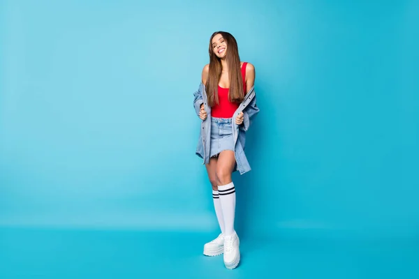 Full size photo of crazy pretty nice girl enjoy spring free time rest relax close eyes feel wind air wear good look bright tank-top shoes legs isolated blue color background — Stockfoto