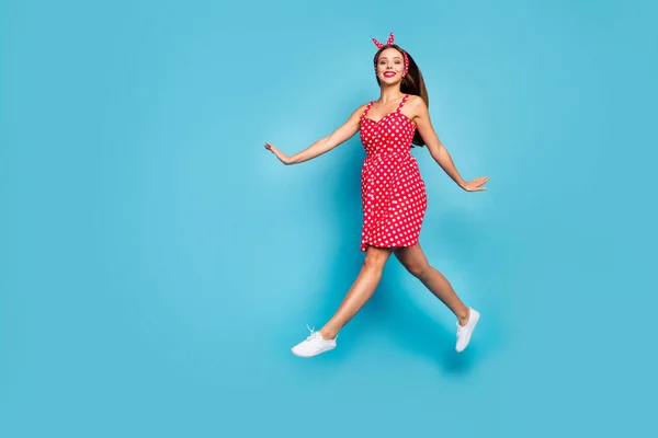 Full length body size view of her she nice-looking attractive lovely lovable winsome cheerful dreamy straight-hair girl jumping going isolated on bright vivid shine vibrant blue color background — стоковое фото