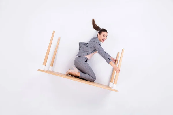 Top above high angle vertical view full body profile side photo of surprised marketer girl sit flatlay table ride fly business appointment wear high heels isolated white color background — Stock Photo, Image