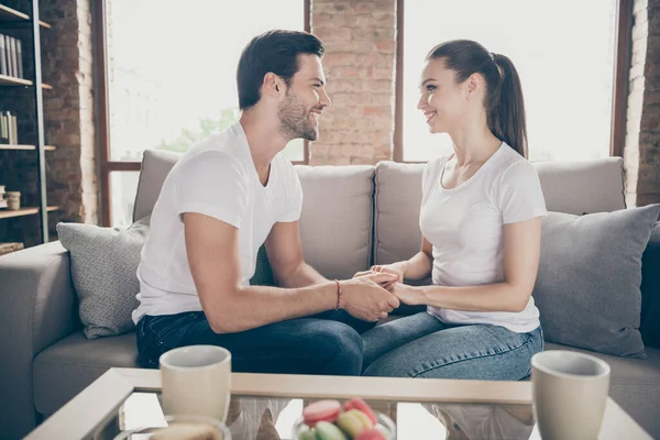 Photo of charming lady handsome guy couple relaxing sit comfy couch look eyes stay home good mood quarantine hold arms chatting listen love words spend time together living room indoors — Stock Photo, Image