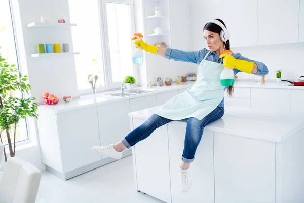 Portrait of her she nice attractive cheerful cheery funny funky playful housewife using spray having fun fighting killing dust struggling in modern light white interior kitchen house — Stock Photo, Image