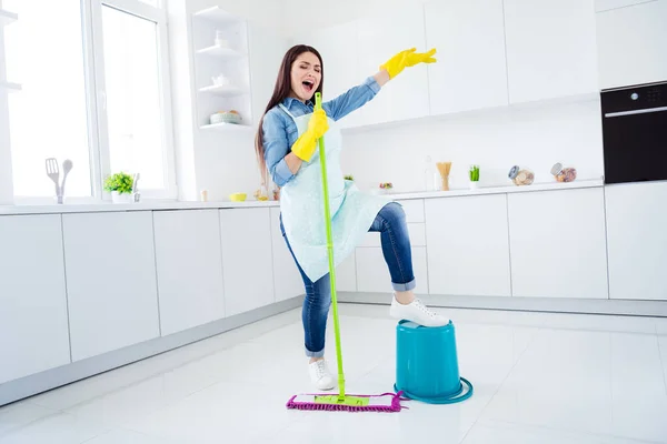 Full length body size view of her she nice attractive funny funky cheerful positive cheery housewife cleansing floor singing song mop like mic having fun in modern light white interior kitchen house — Stock Photo, Image