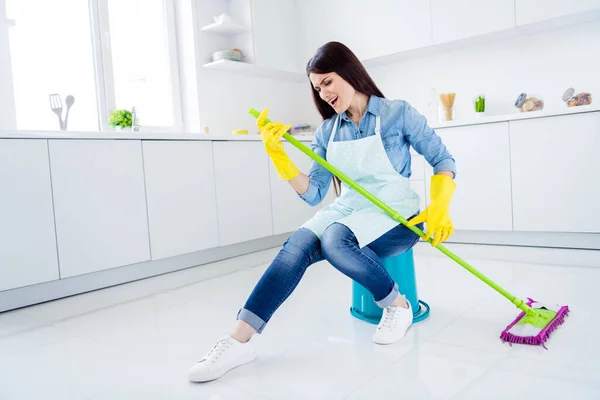 Portrait of her she nice attractive funny funky cheerful positive playful comic cheery housewife cleansing floor playing mop like guitar in modern light white interior kitchen house — Stock Photo, Image