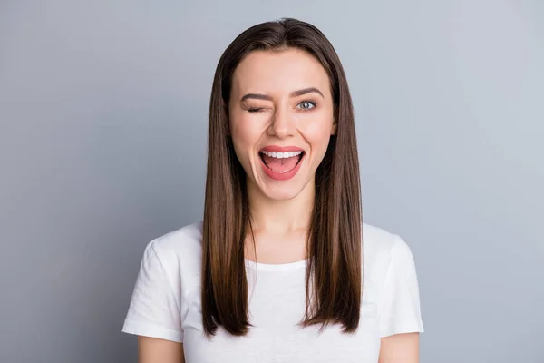 Portrait of nice candid pretty youngster girl enjoy her holiday spring rest relax wink blink wear casual style clothes isolated over gray color background — Stock Photo, Image