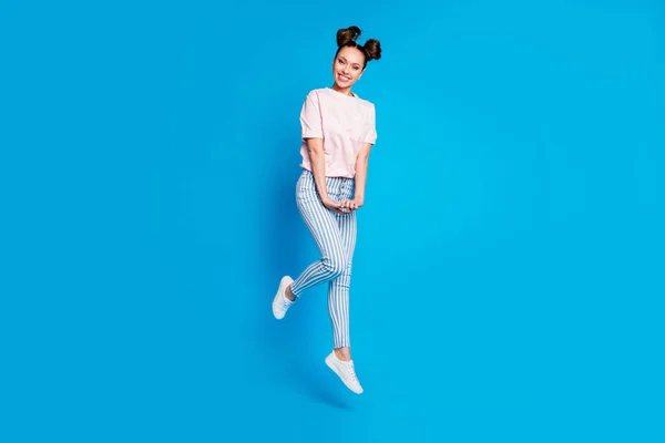 Full length body size view of her she nice attractive lovely cute shy charming cheerful cheerful girl jumping posing expecting first date isolated on bright vivid shine vibrant blue color background — стоковое фото