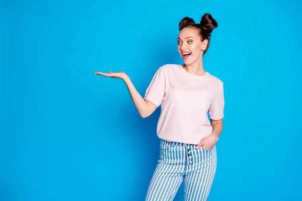 Portrait of her she nice-looking attractive pretty lovely cheerful cheery glad girl holding on palm copy empty blank space place isolated on bright vivid shine vibrant blue color background — Stock Photo, Image