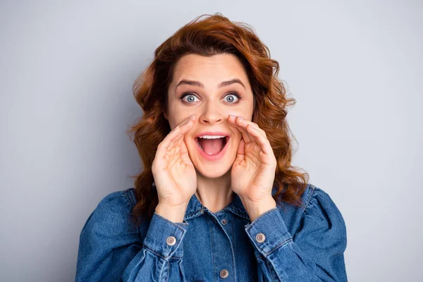 Closeup photo of attractive curly lady hold arms near mouth sharing new information people crowd yelling advertisement wear casual blue denim shirt isolated grey color background — Stock Photo, Image